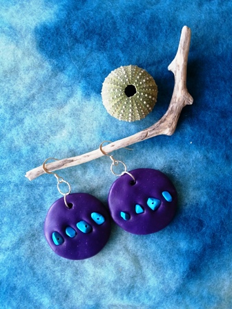 purple round bead decorated with blue beads