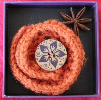 orange knitted brooch