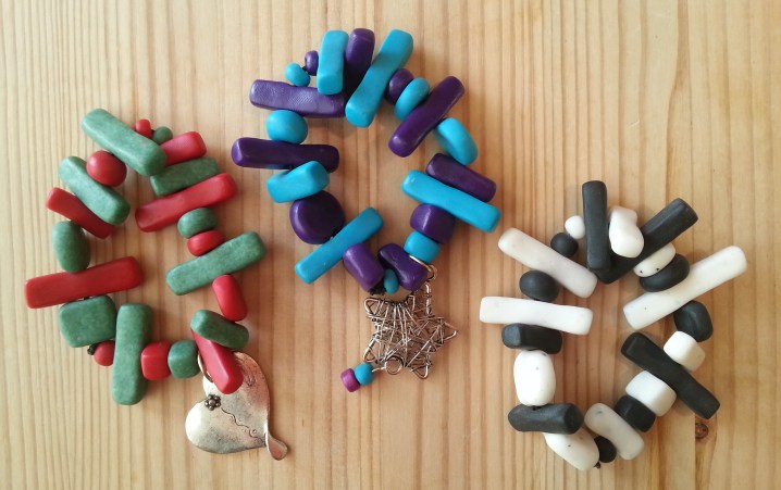 bracelets with handmade beads in various shapes and colours